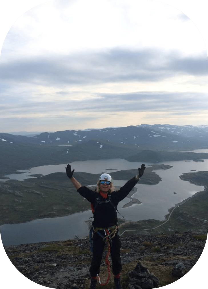 picture of a happy woman on a mountain